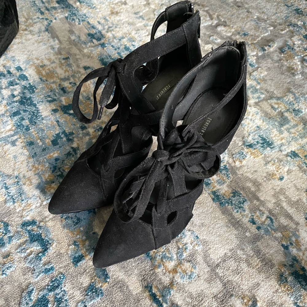Black crisscrossing heels
